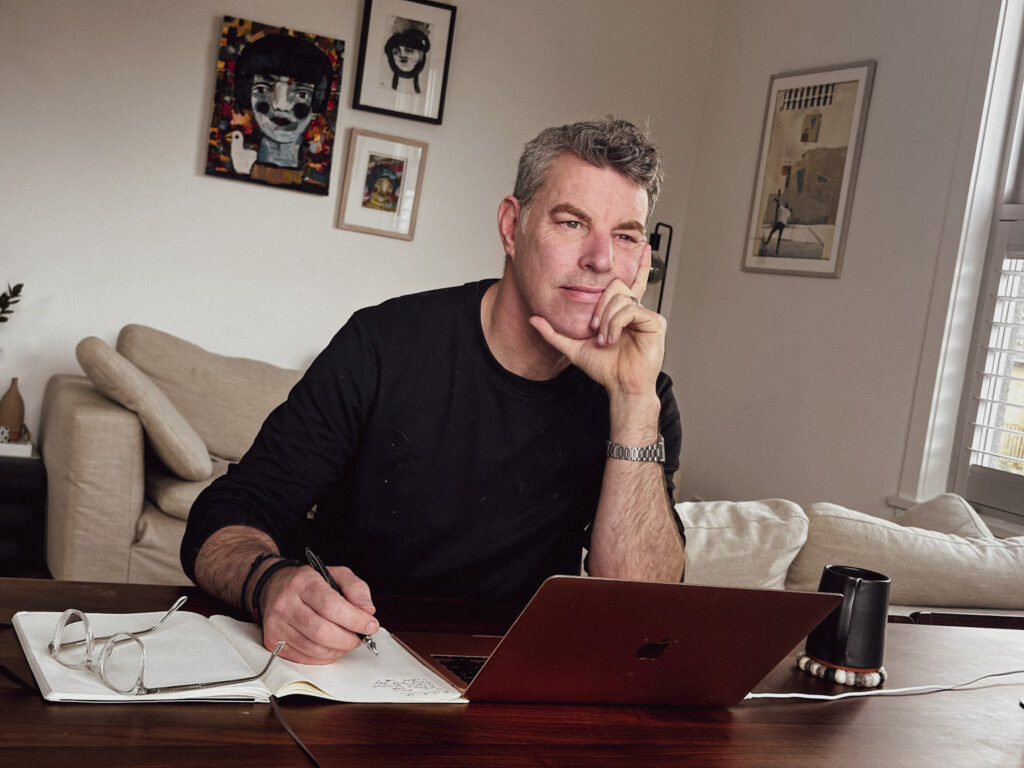 A photo of therapist Justin Morrison sitting at a desk