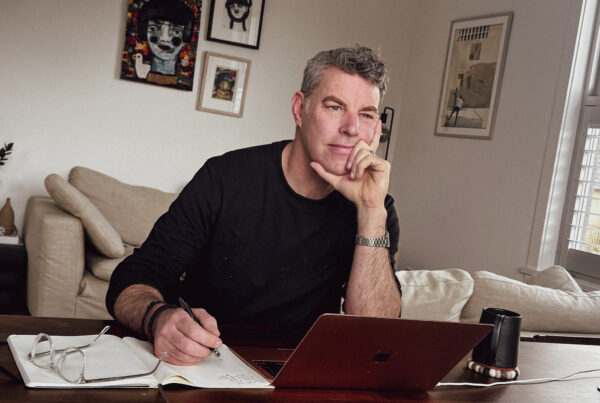 A photo of therapist Justin Morrison sitting at a desk